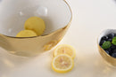 Stylish large serving bowl from Pampa Bay's Moonlight collection, featuring a gold tarnish-free outer surface, a white inner surface, and an organic gold rim.