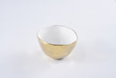 Pampa Bay Moonlight serving bowl, featuring a white porcelain body and a luxurious gold titanium edge that resists tarnishing.