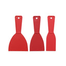 A small, hand-held red plastic tool with a flexible, wide blade and a hole in the handle for hanging.