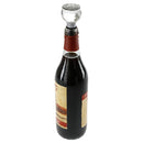 Clear crystal wine cork with an ornament-shaped top in a wine bottle on a white background.