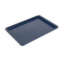 KitchenAid 13x18-inch nonstick baking sheet in ink blue with extended side handles on a white background.