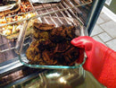 Elbee Home heat-resistant oven mitts in red silicone with extended black fabric cuffs for forearm protection and an easy-clean, non-slip grip.