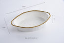 Pampa Bay oval baking dish in white, accented with a bright gold beaded border for a touch of elegance.