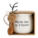 Mud Pie hot cocoa mug with wooden roasting fork topped with faux marshmallow, set on a white background.